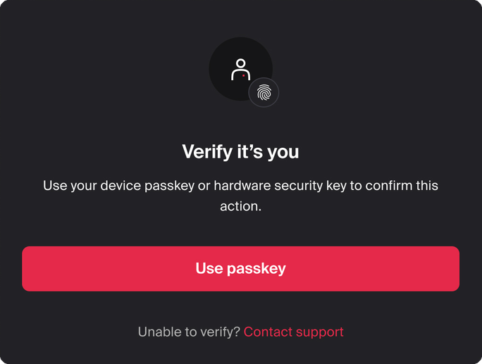 Verify it's you window: use your device passkey or hardware security key to confirm this action, with a Use passkey button and a Contact support link.