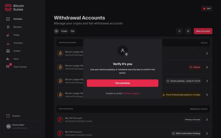 Withdrawal Accounts page with status labels and a passkey confirmation window.
